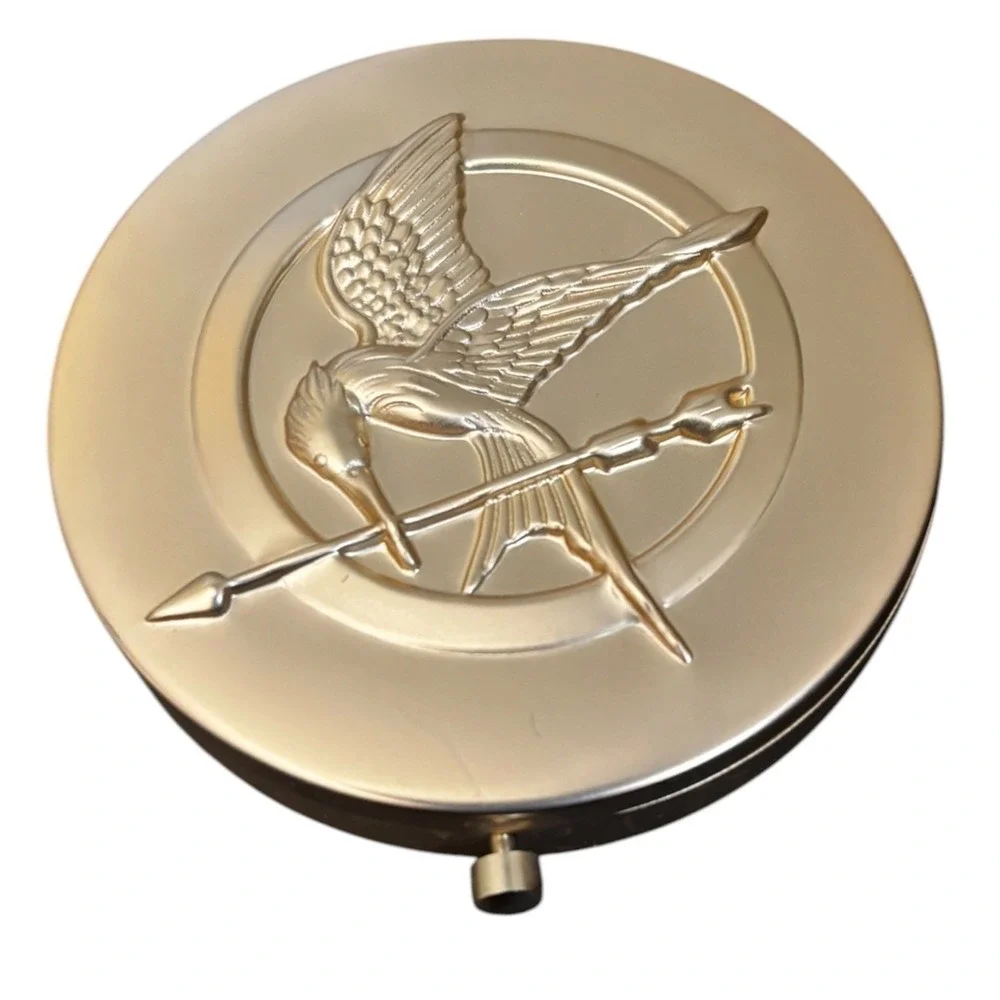 Storybook Cosmetics Hunger Games Girl on Fire Pressed Powder Highlighter Gold